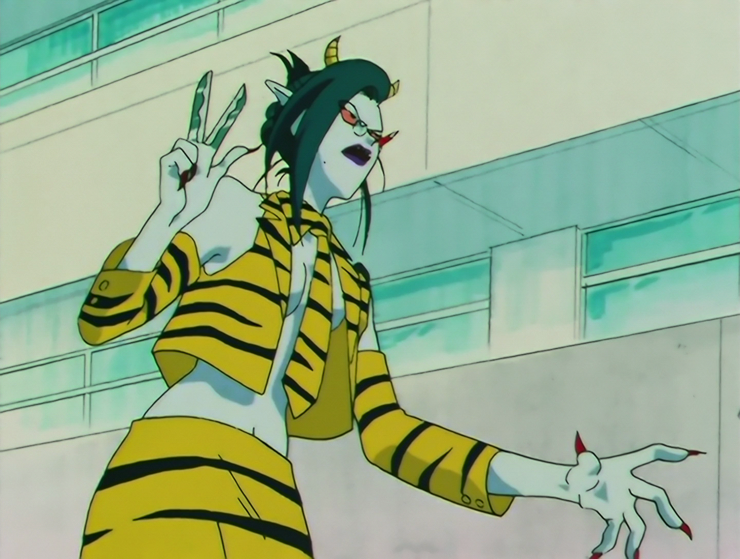 U-Henshuu, a Daimon from Sailor Moon episode 113. She has pale blue skin and dark green hair tied up in a bun, with small demon horns on her head. Her outfit consists of an open jacket  worn over her naked torso, with a tie, collar and skirt. All are made of jello fabric with black tiger stripes. She has a pencil behind one ear, has long red nails, and two of her fingers on one hand form a pair of scissors.